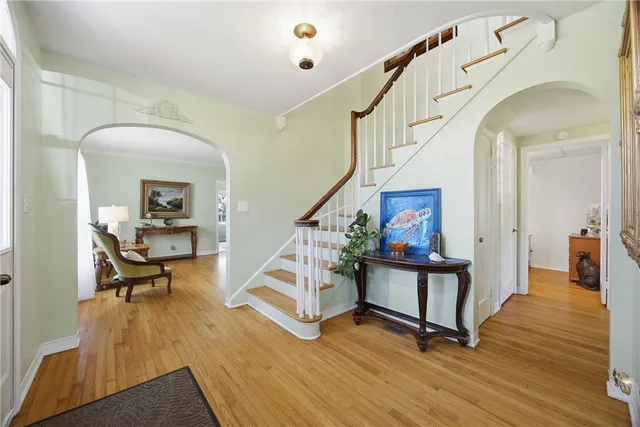 a view of entryway dining room and hall with wooden floor