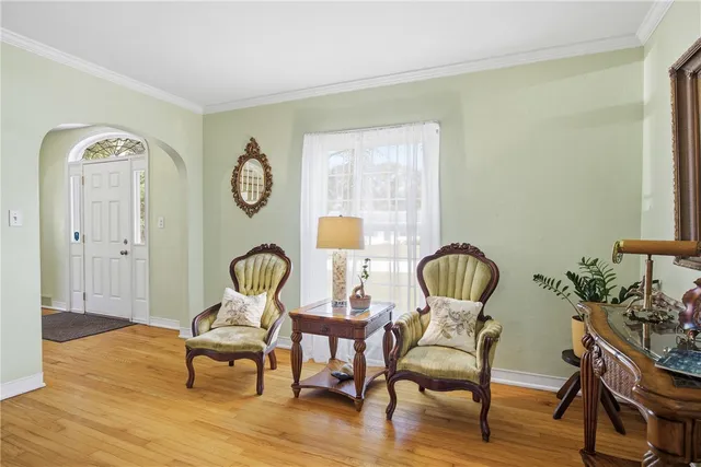 a view of a room with furniture and wooden floor