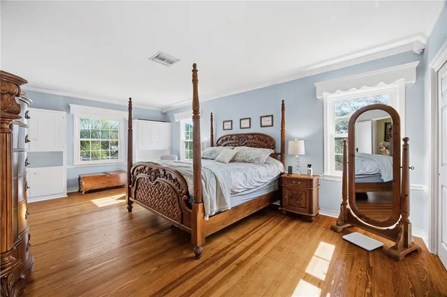 a bed room with a bed and a window