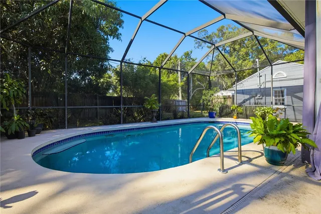 a view of a swimming pool with a patio