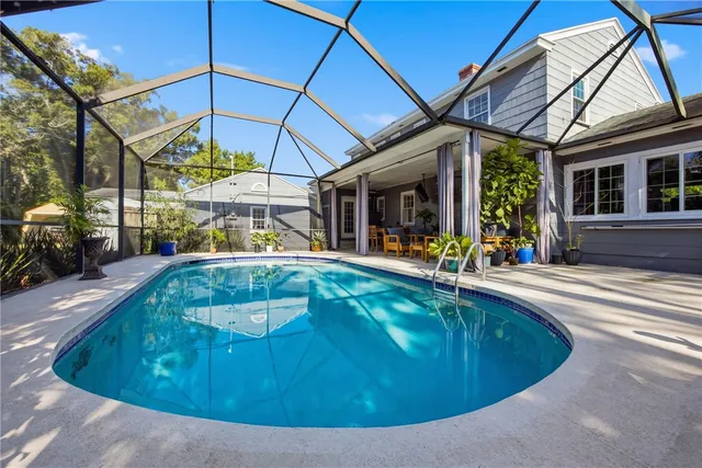 a view of a swimming pool with a patio