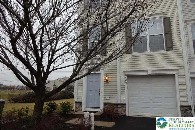 a front view of a house with a garage