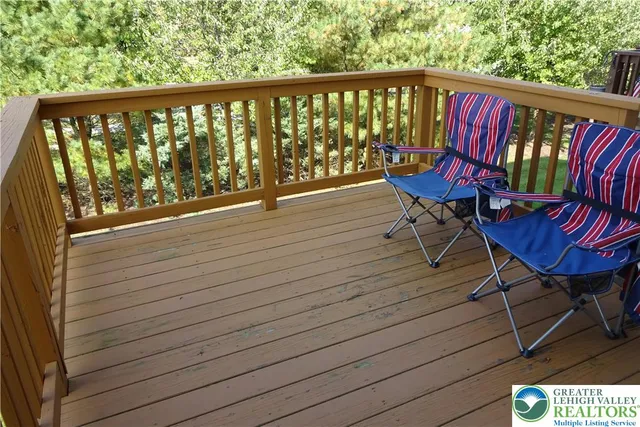 a view of a balcony with wooden floor