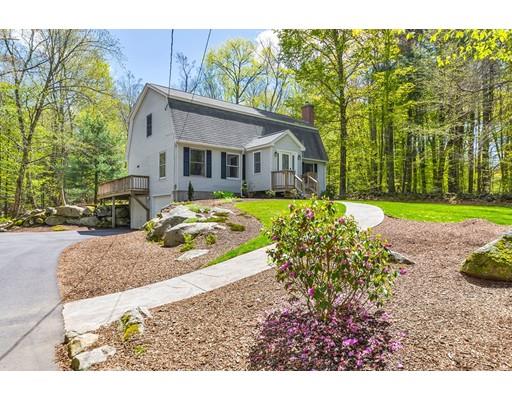 125 Thayer Road Monson, MA 01057 - Photo 1 of 30 a front view of a house with a yard and trees