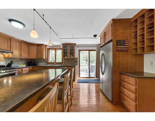 125 Thayer Road Monson, MA 01057 - Photo 11 of 30 a kitchen with counter top space cabinets and wooden floor