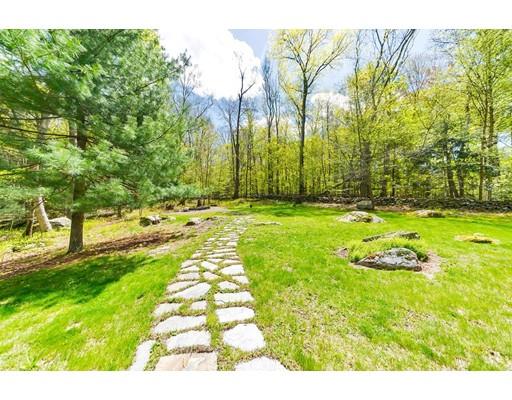 125 Thayer Road Monson, MA 01057 - Photo 29 of 30 a backyard of a house with lots of green space and garden