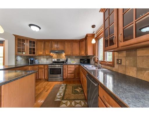 125 Thayer Road Monson, MA 01057 - Photo 7 of 30 a kitchen with stainless steel appliances granite countertop a stove a sink and a microwave