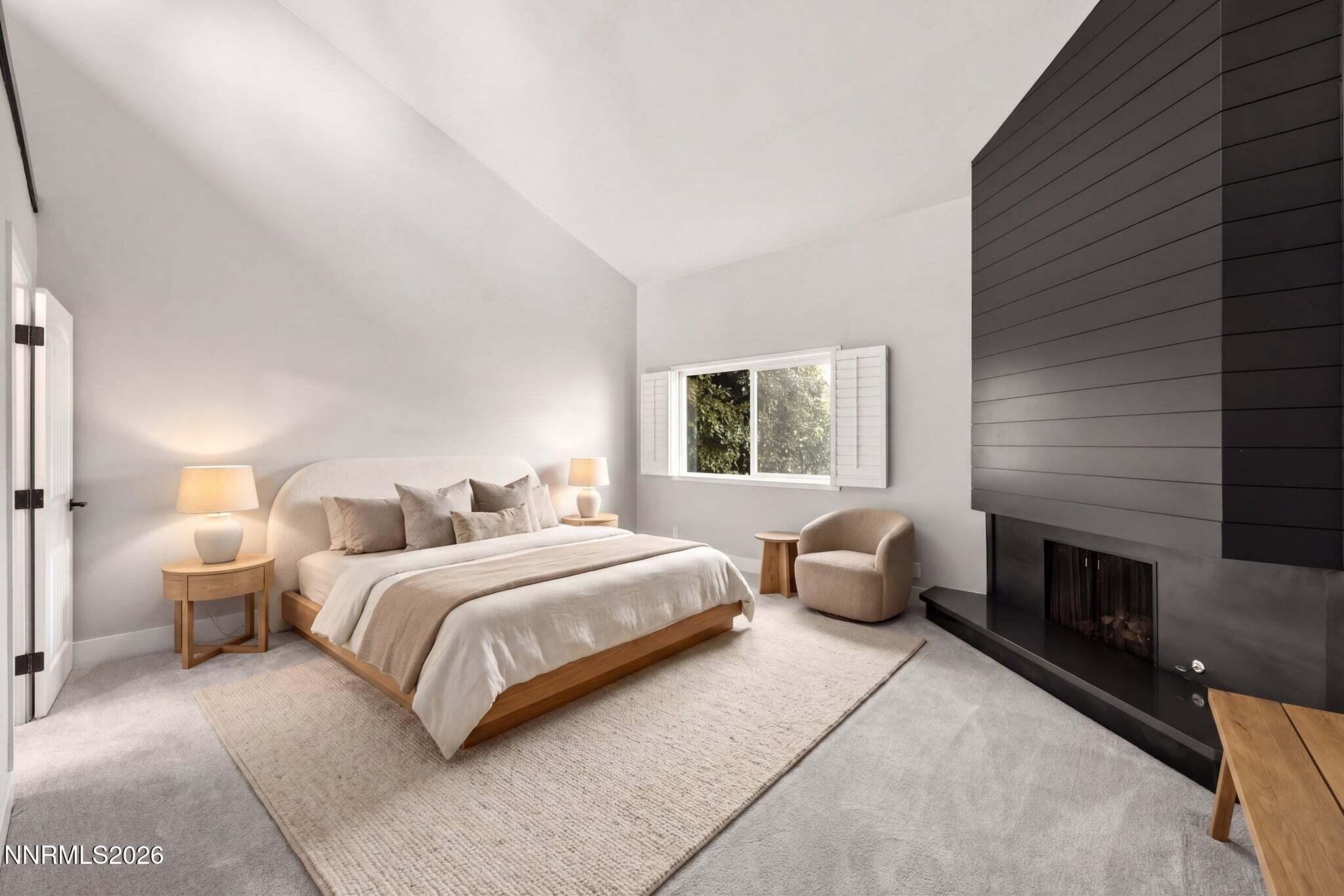 430 Angela Place Reno, NV 89509 - Photo 34 of 48 a bedroom with a bed and a fireplace