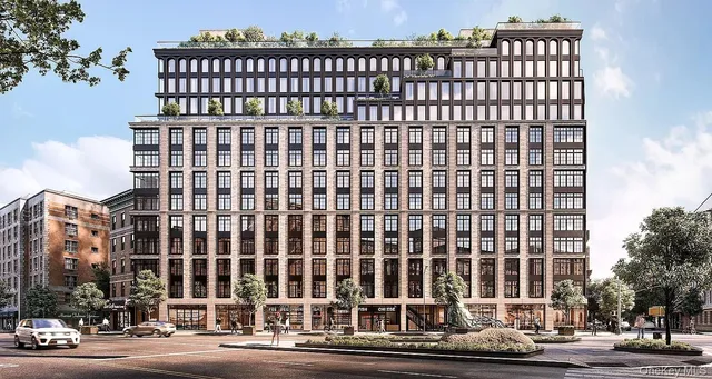 a view of a building with a street