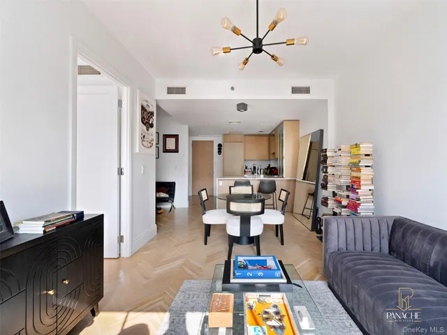 a living room with furniture fireplace and a window