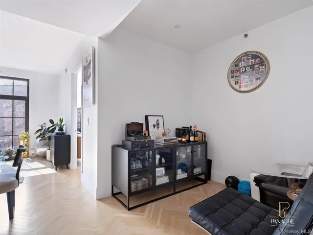 a bed room with a bed and a chair