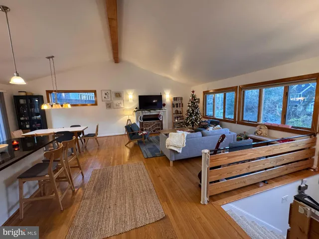 a living room with furniture fireplace and flat screen tv