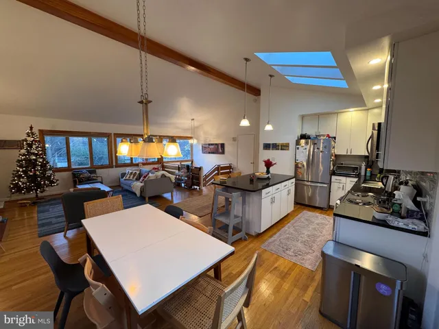 a large kitchen with a table and chairs