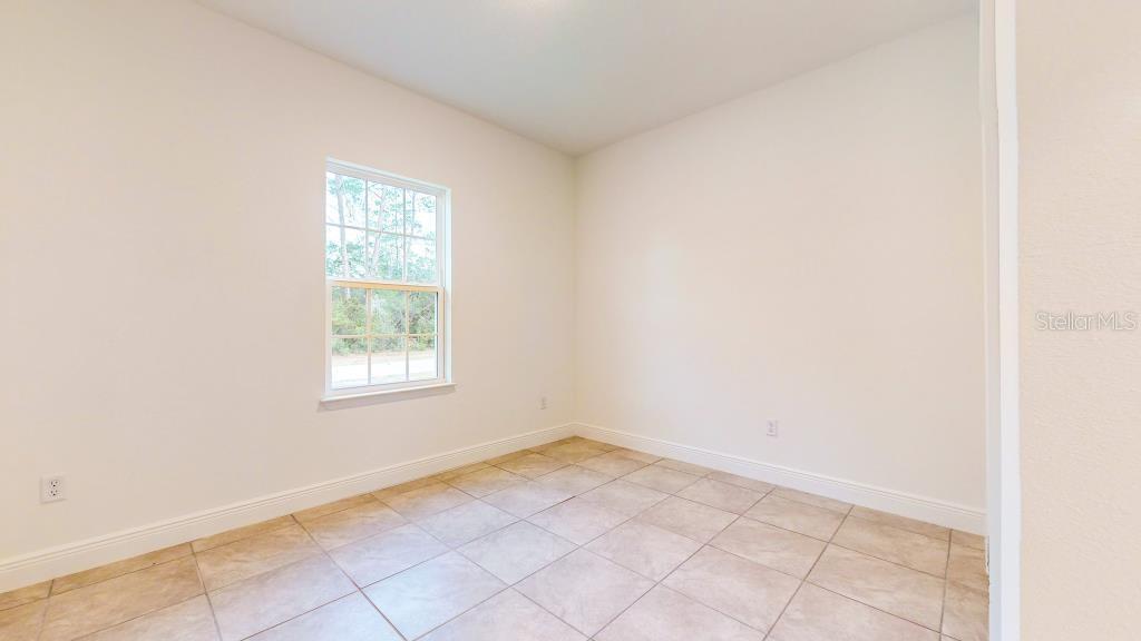 9809 North Swanee Terrace Dunnellon, FL 34433 - Photo 20 of 24 an empty room with a window