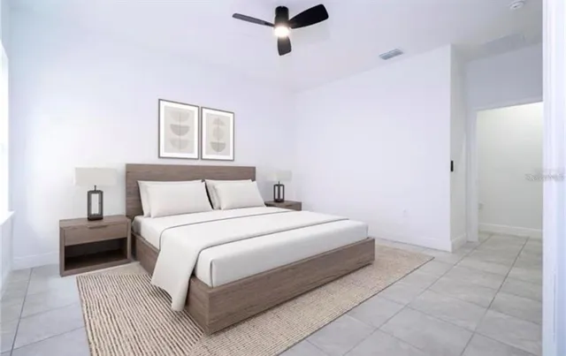 a bedroom with a bed and a night stand