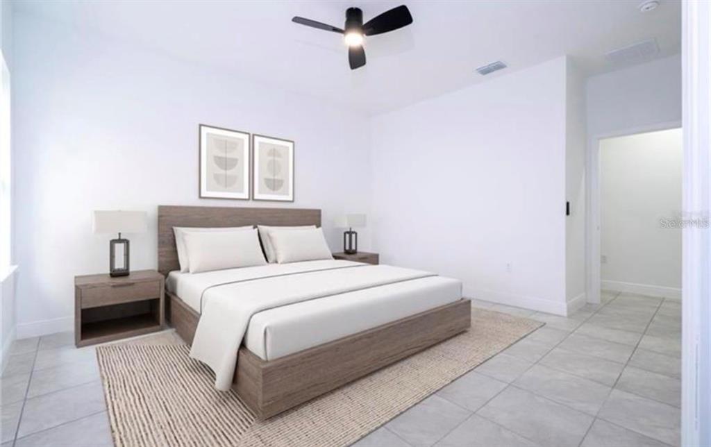 9809 North Swanee Terrace Dunnellon, FL 34433 - Photo 7 of 24 a bedroom with a bed and a night stand