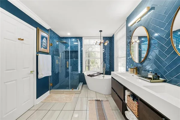 a view of hall way with mirror and furniture