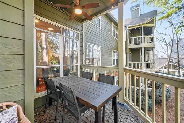 an aerial view of a house with a yard and large trees
