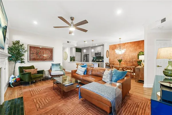 a living room with furniture and a fireplace