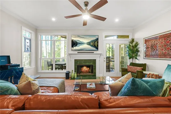 a kitchen with stainless steel appliances granite countertop a stove a refrigerator a oven a sink with a dining table and chairs