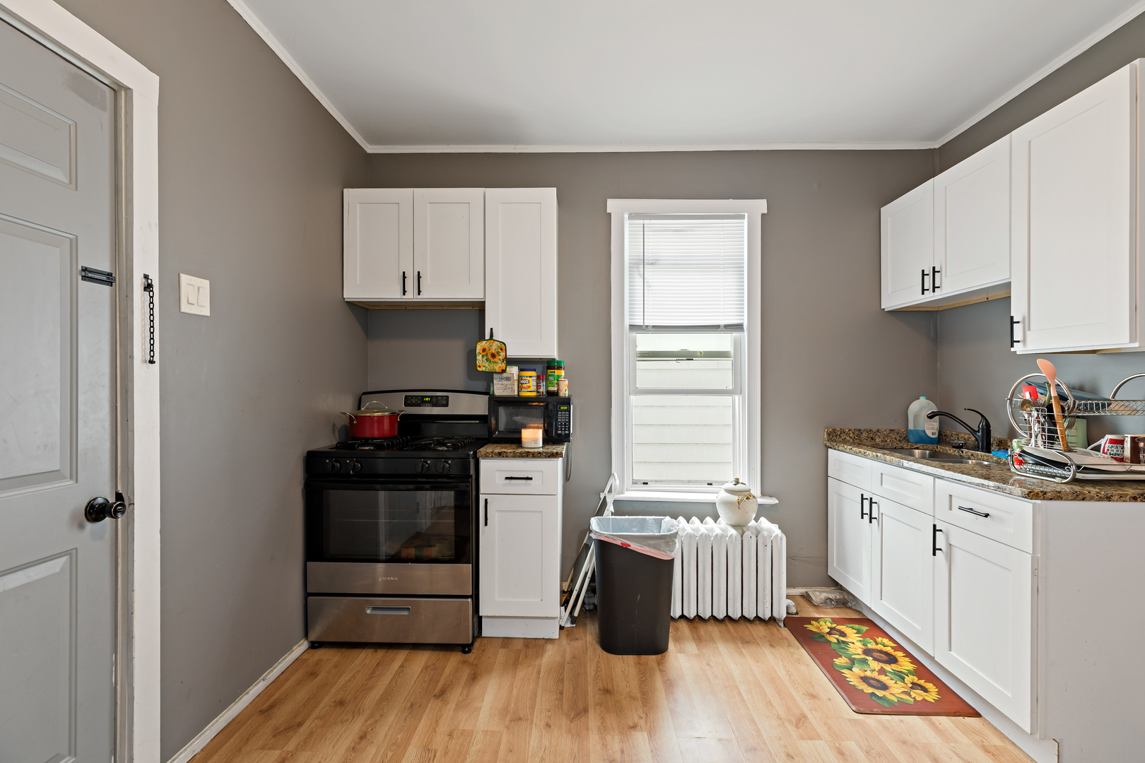 3441 Chicago Road Steger, IL 60475 - Photo 18 of 28 a kitchen with granite countertop a stove and a refrigerator