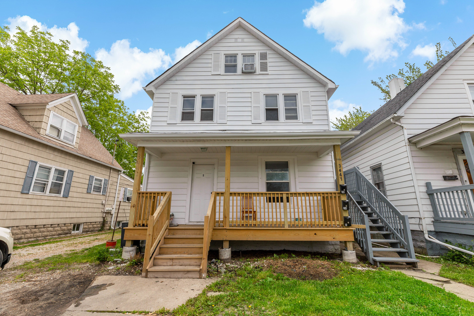 3441 Chicago Road Steger, IL 60475 - Photo 24 of 28 a front view of a house with a garden