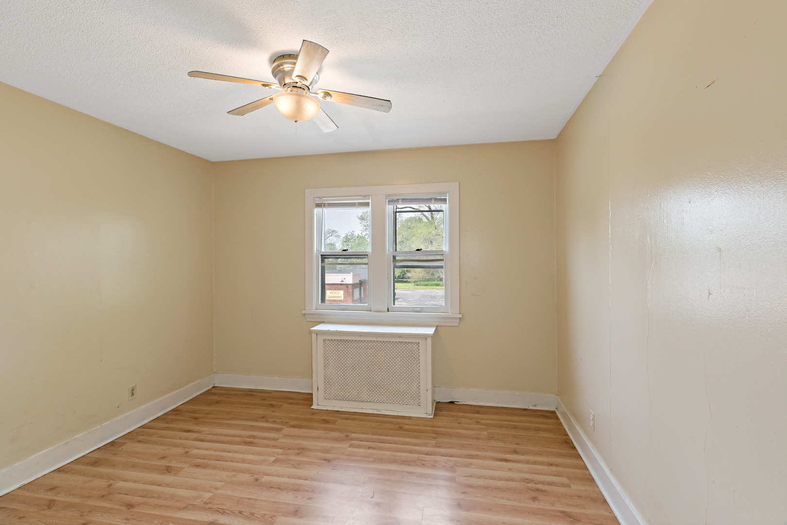 3441 Chicago Road Steger, IL 60475 - Photo 6 of 28 an empty room with wooden floor and windows