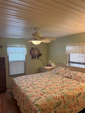 a bed room with a bed and a window