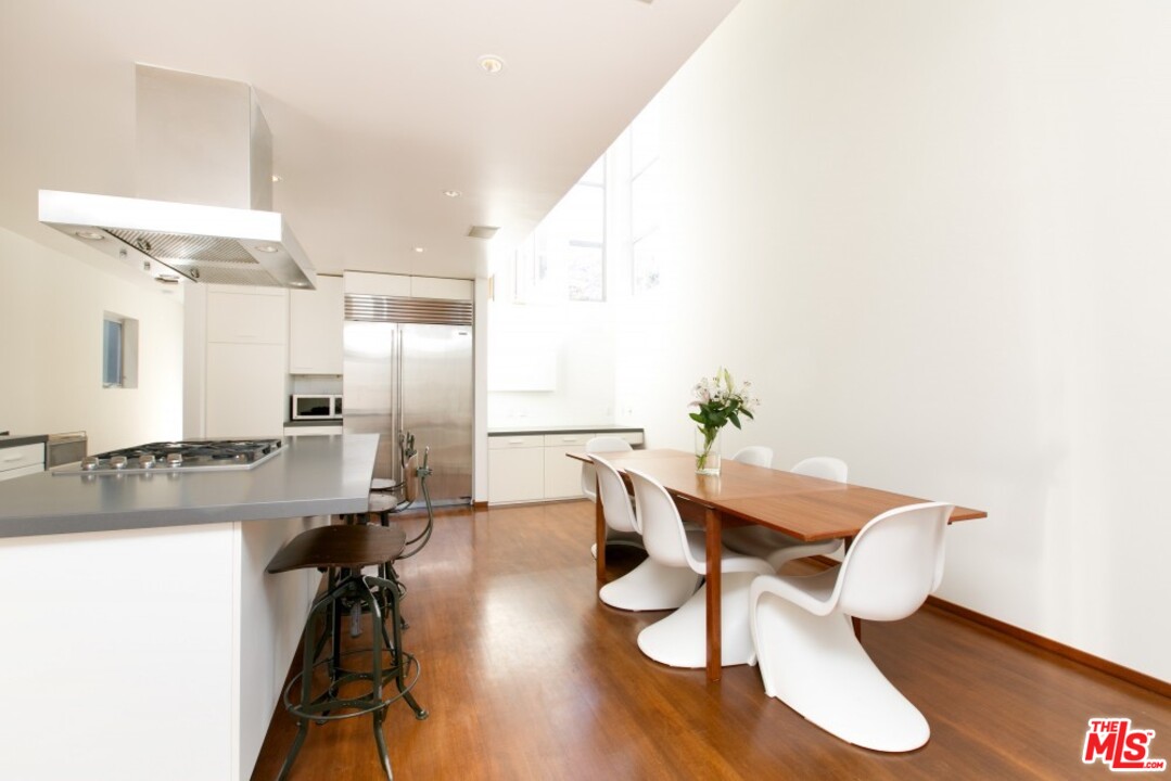 216 Grand Boulevard Venice, CA 90291 - Photo 8 of 28 a dining room with furniture and wooden floor