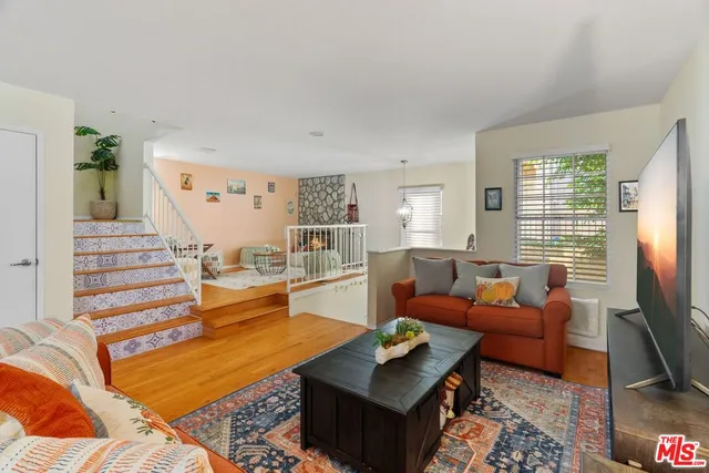 a living room with furniture fireplace and flat screen tv