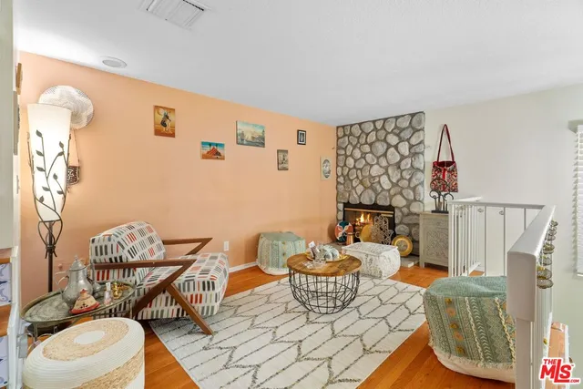 a living room with furniture and a dining table