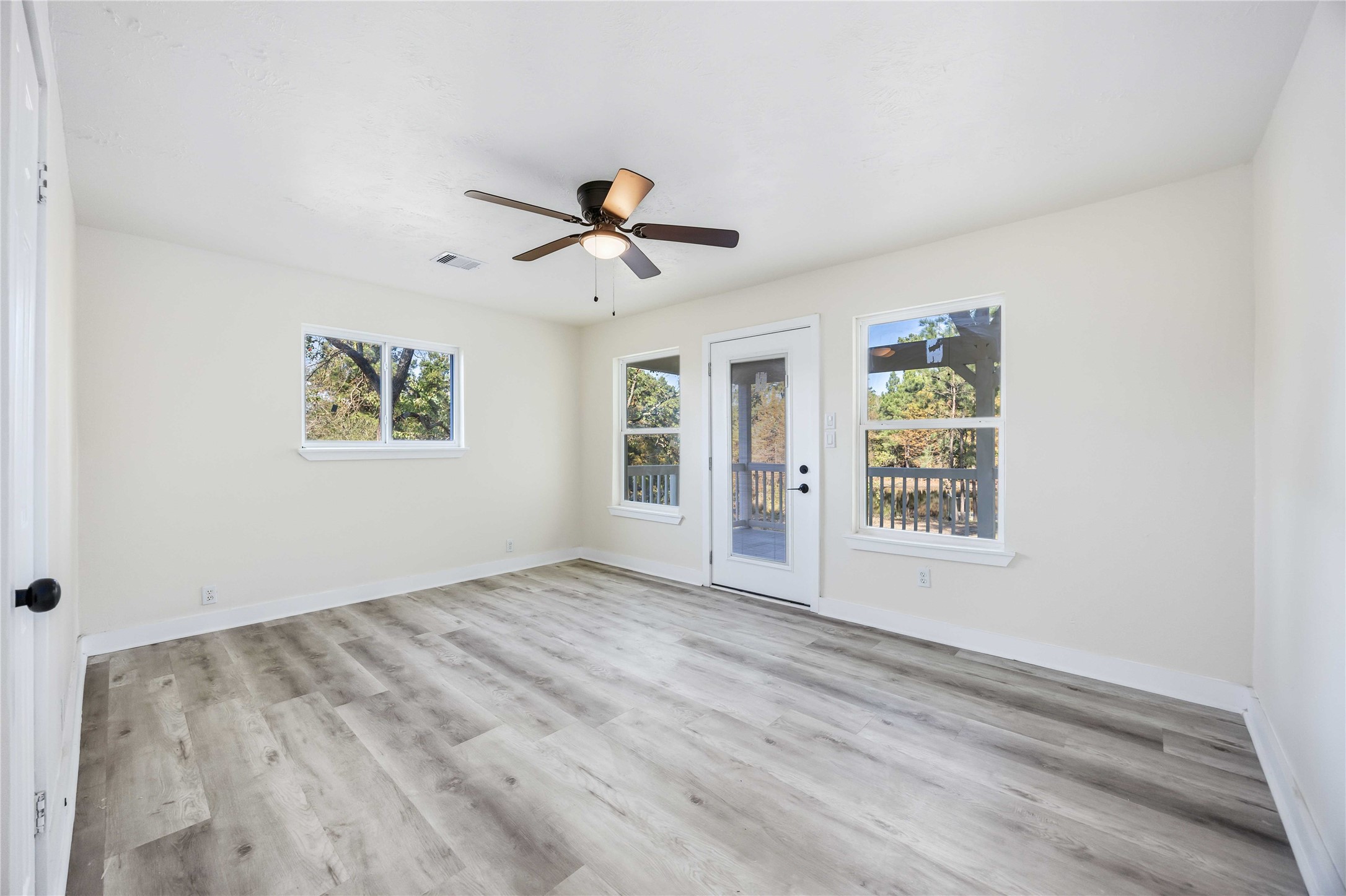 18234 Atkinson Lane Conroe, TX 77384 - Photo 18 of 30 a view of an empty room with a window