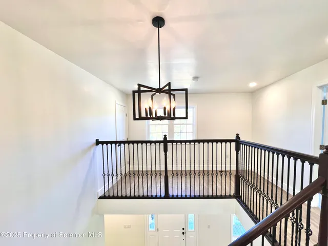 a view of a hallway with windows