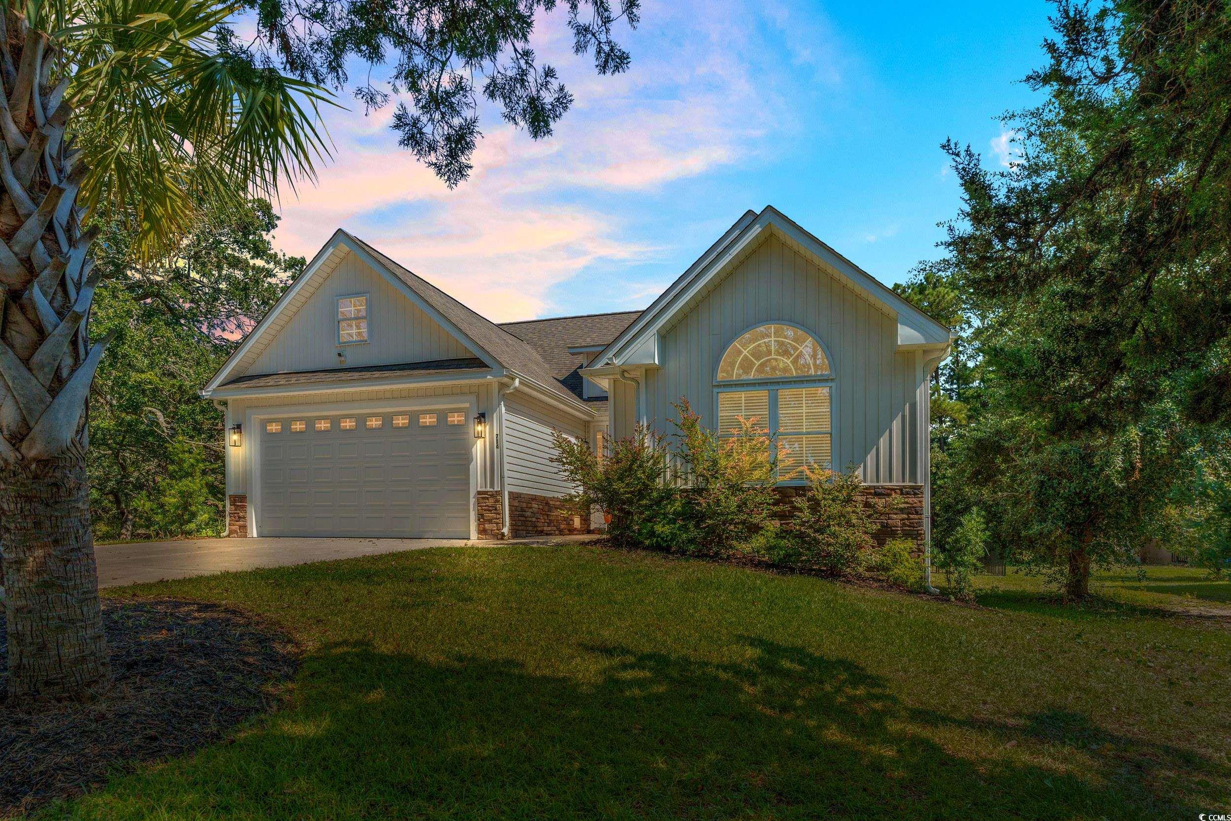 714 Charlotte Road Myrtle Beach, SC 29577 - Photo 1 of 30 View of front of property with a front lawn, driveway, and a garage
