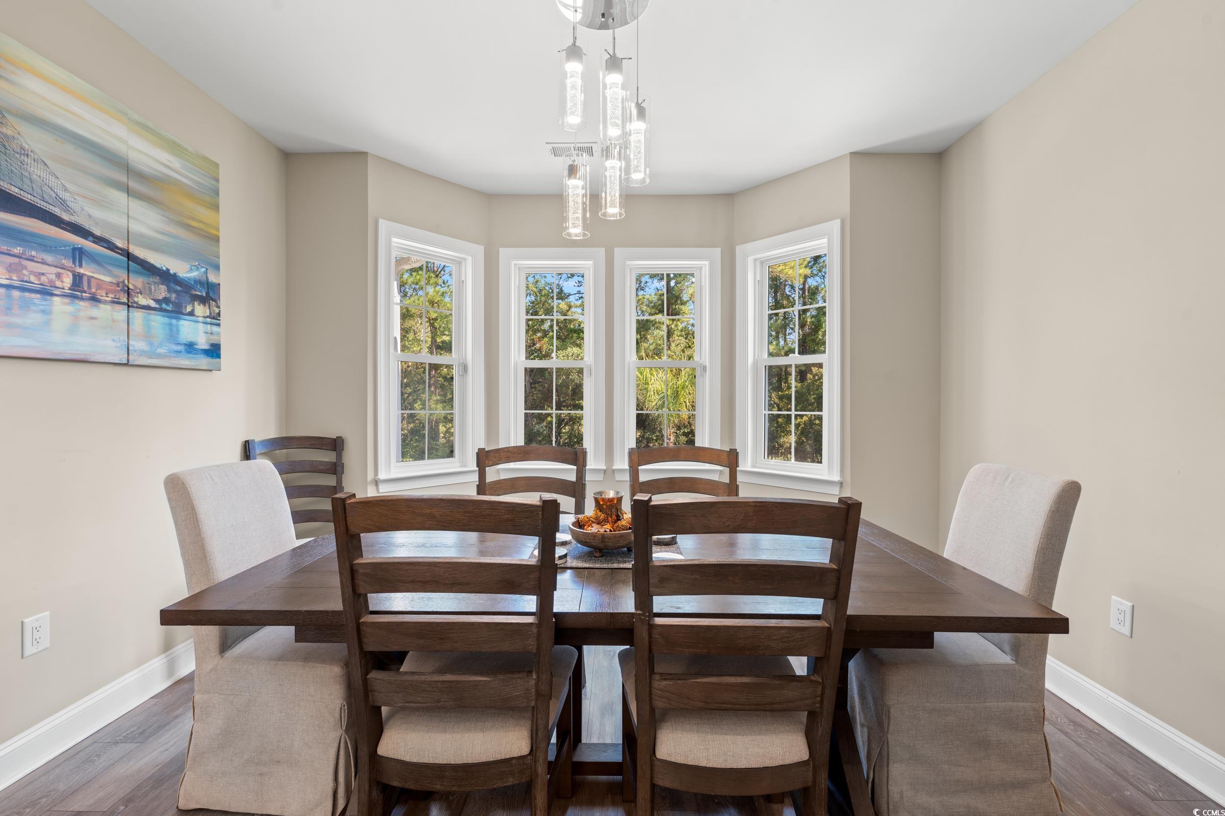 714 Charlotte Road Myrtle Beach, SC 29577 - Photo 11 of 30 Dining room featuring baseboards and wood finished floors