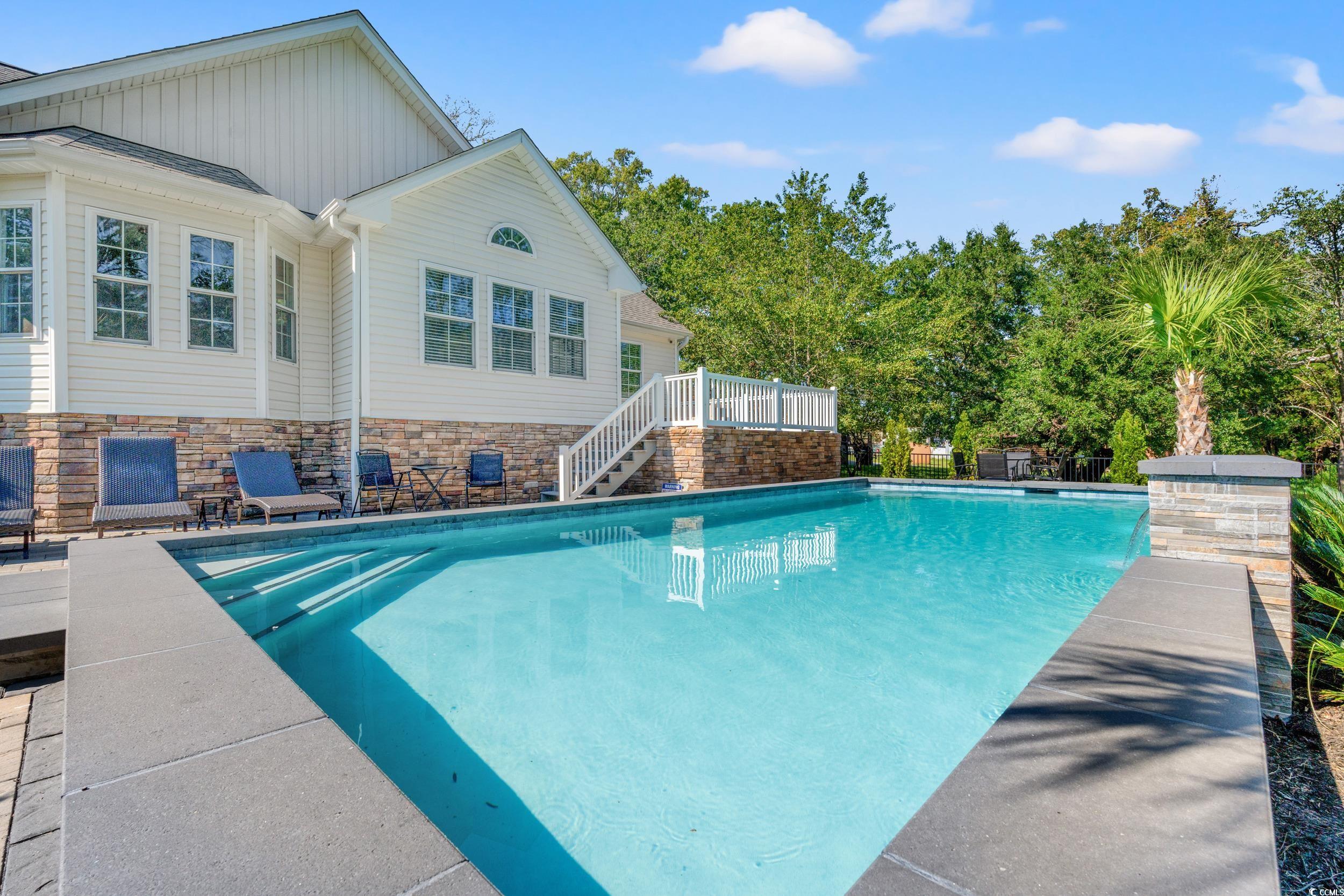 714 Charlotte Road Myrtle Beach, SC 29577 - Photo 26 of 30 Swimming pool featuring a patio area and stairway