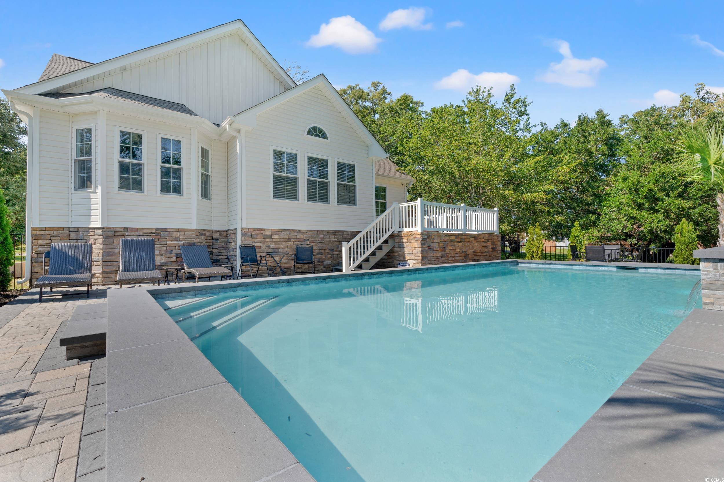 714 Charlotte Road Myrtle Beach, SC 29577 - Photo 4 of 30 Outdoor pool featuring a patio and stairs