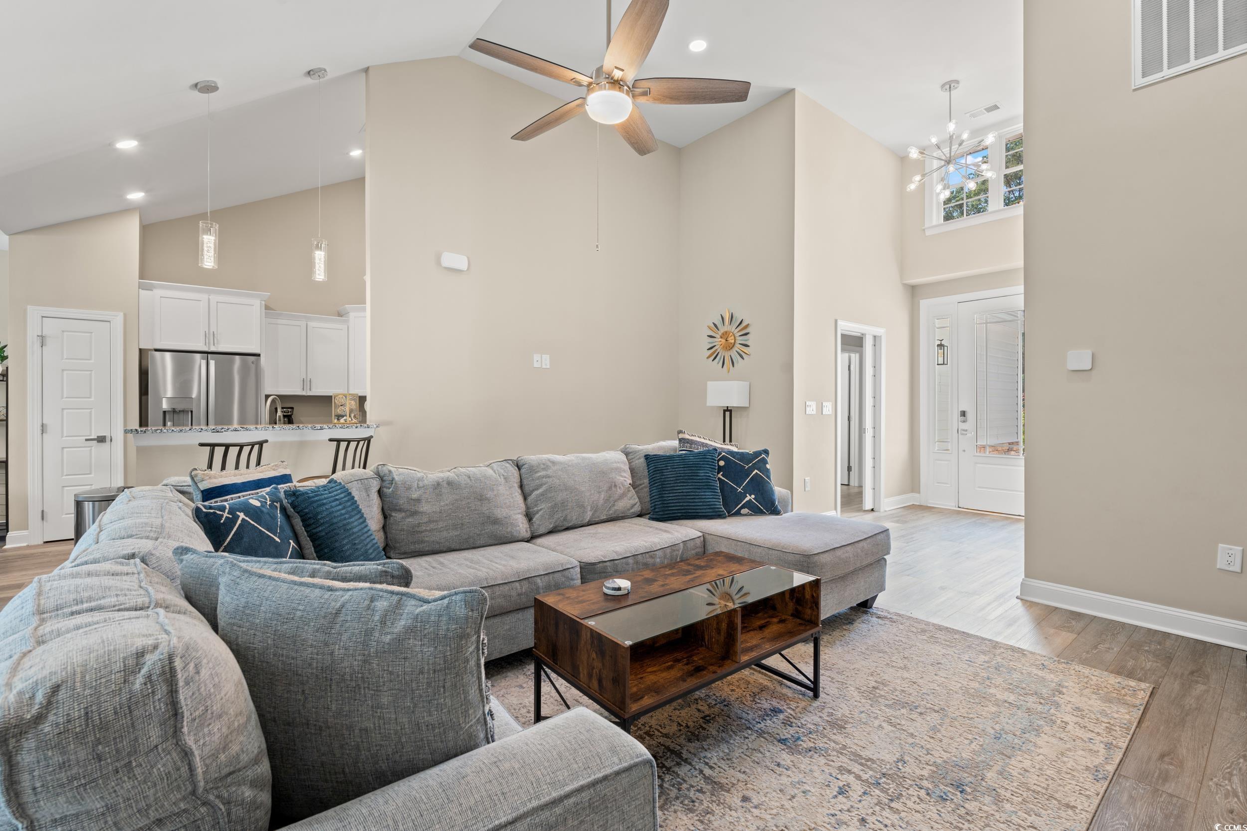 714 Charlotte Road Myrtle Beach, SC 29577 - Photo 6 of 30 Living area featuring high vaulted ceiling, light wood-type flooring, a ceiling fan, a chandelier, and recessed lighting