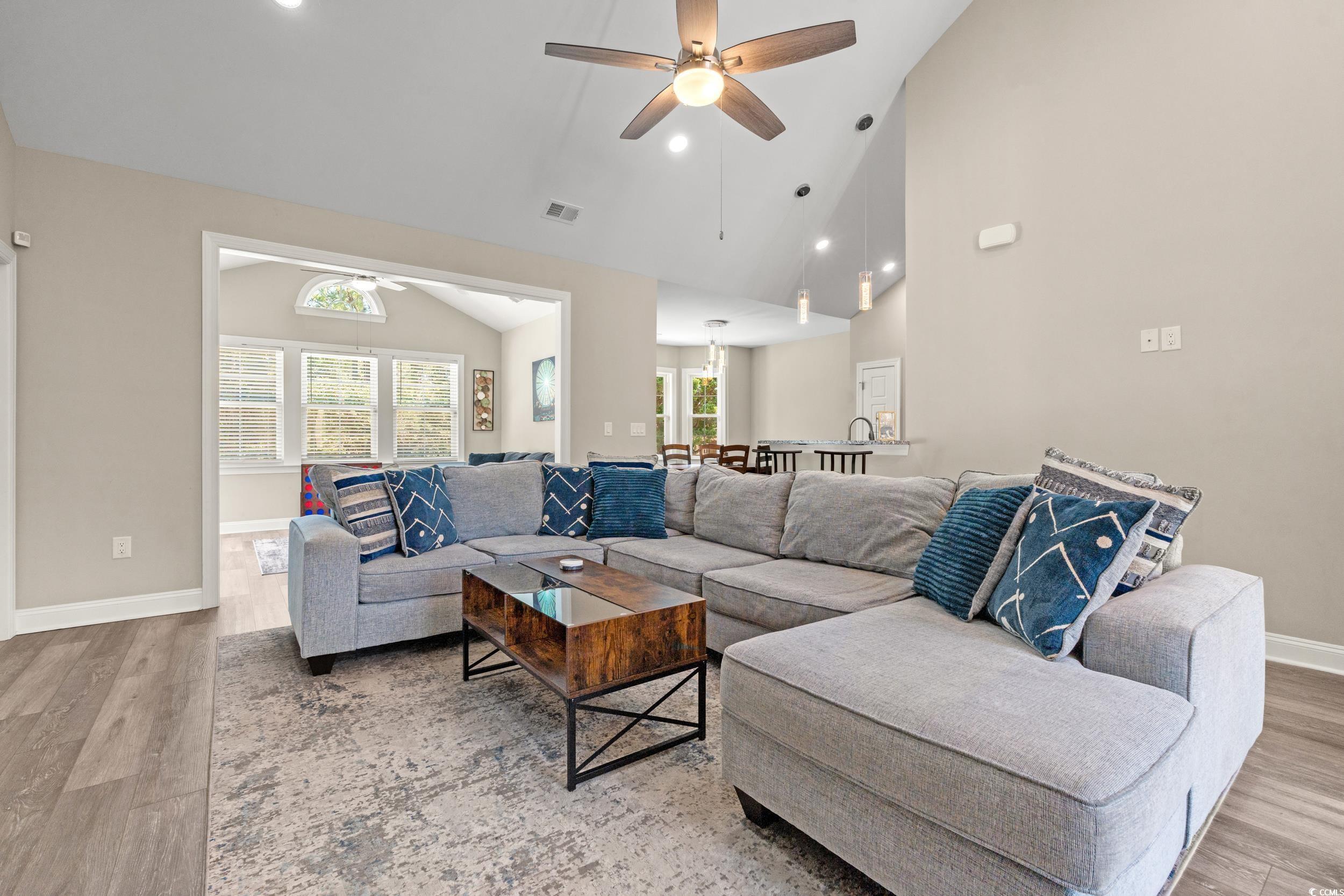 714 Charlotte Road Myrtle Beach, SC 29577 - Photo 8 of 30 Living area with a ceiling fan, light wood finished floors, high vaulted ceiling, and recessed lighting