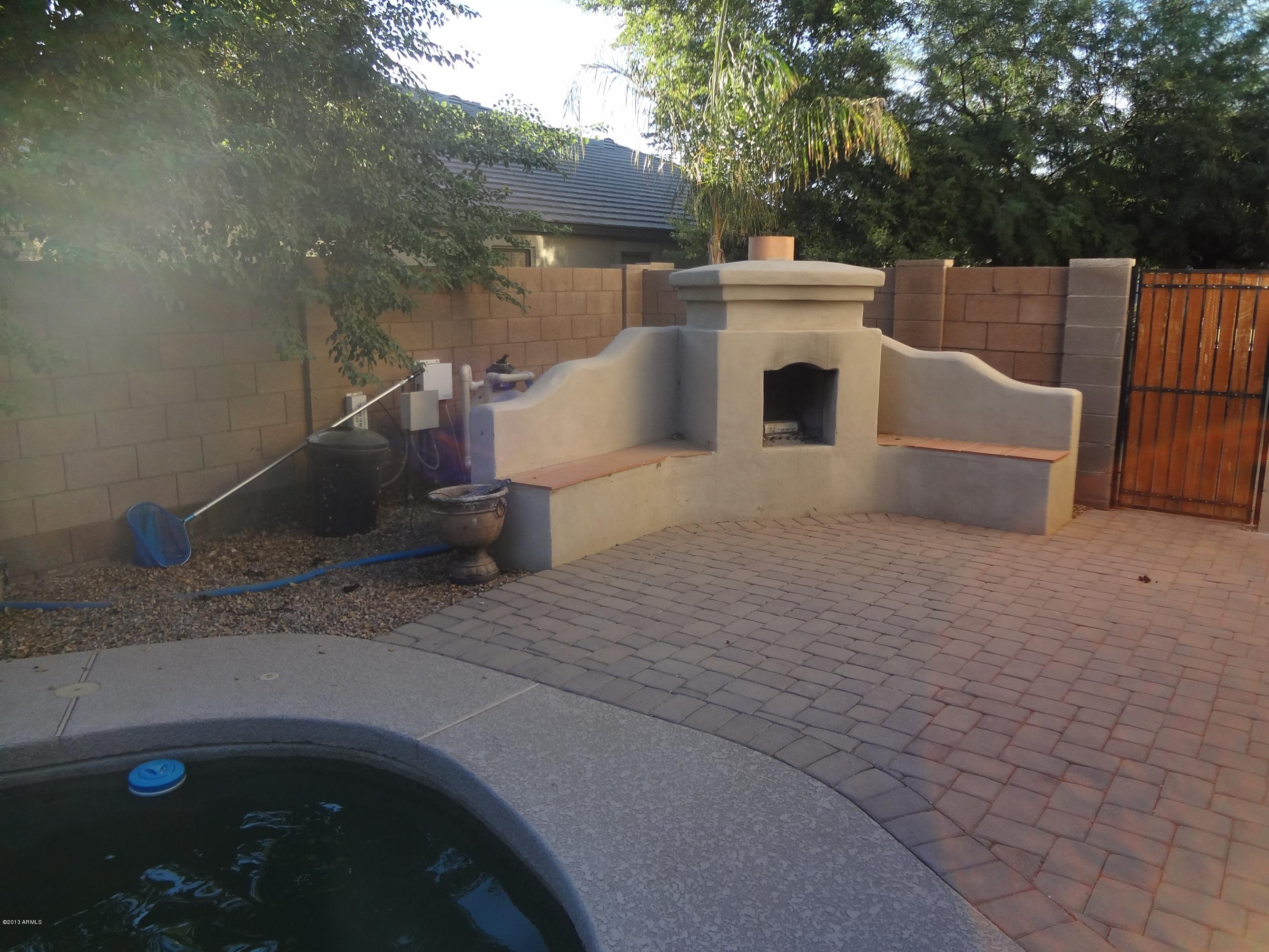 3399 East Kimball Road Gilbert, AZ 85297 - Photo 29 of 34 Backyard fireplace
