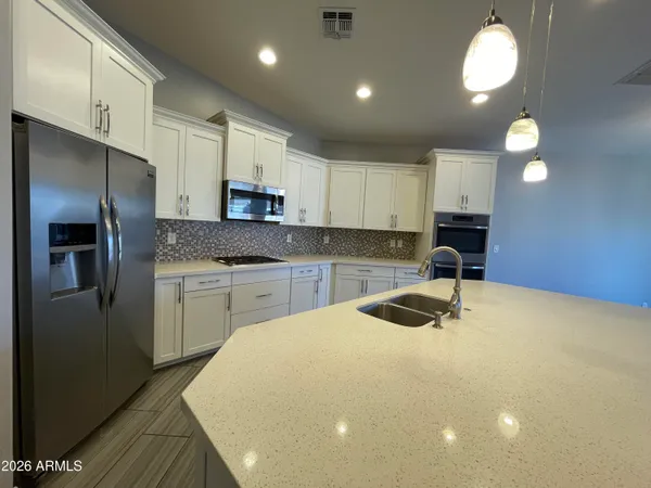 a view of a house with swimming pool and sitting area