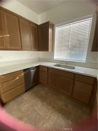 a kitchen with sink and window