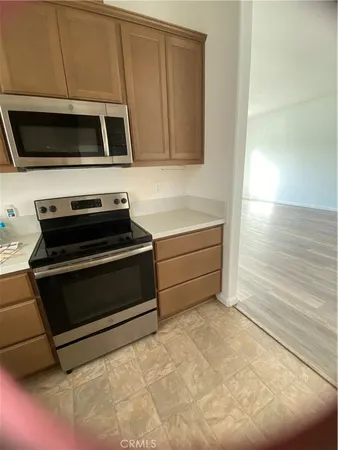 a kitchen with a stove and a microwave