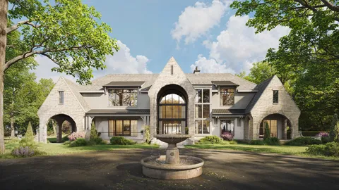 a front view of a house with garden water fountain and trees