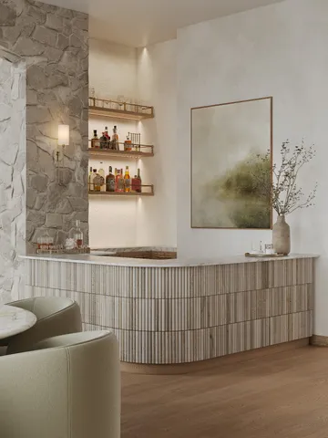 a large room with a table chairs wooden floor and a view of living room