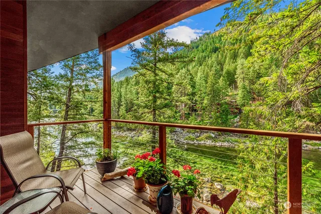a view of a chairs and table in the balcony