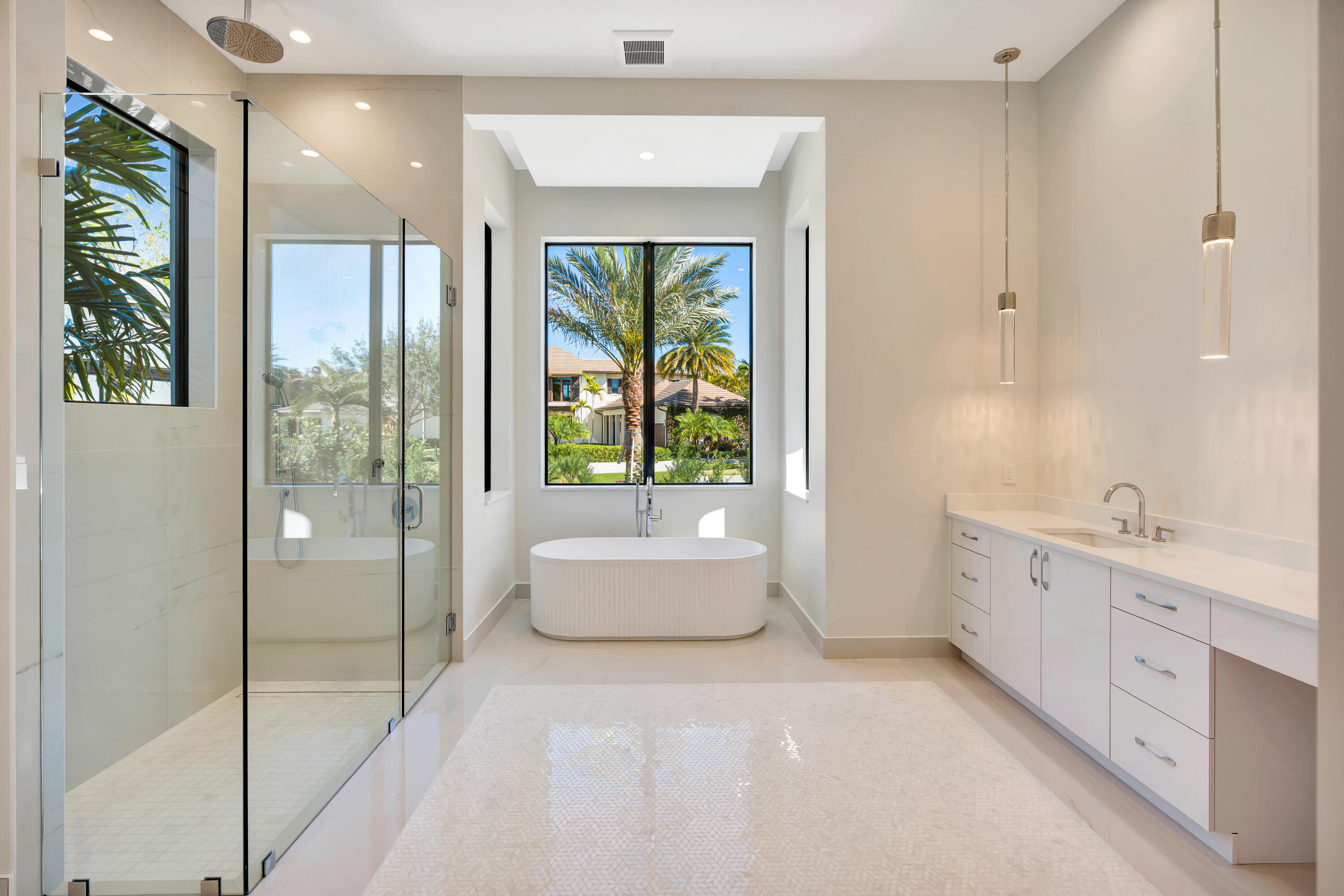 112 Regatta Drive Jupiter, FL 33477 - Photo 32 of 85 a spacious bathroom with a bathtub and a shower