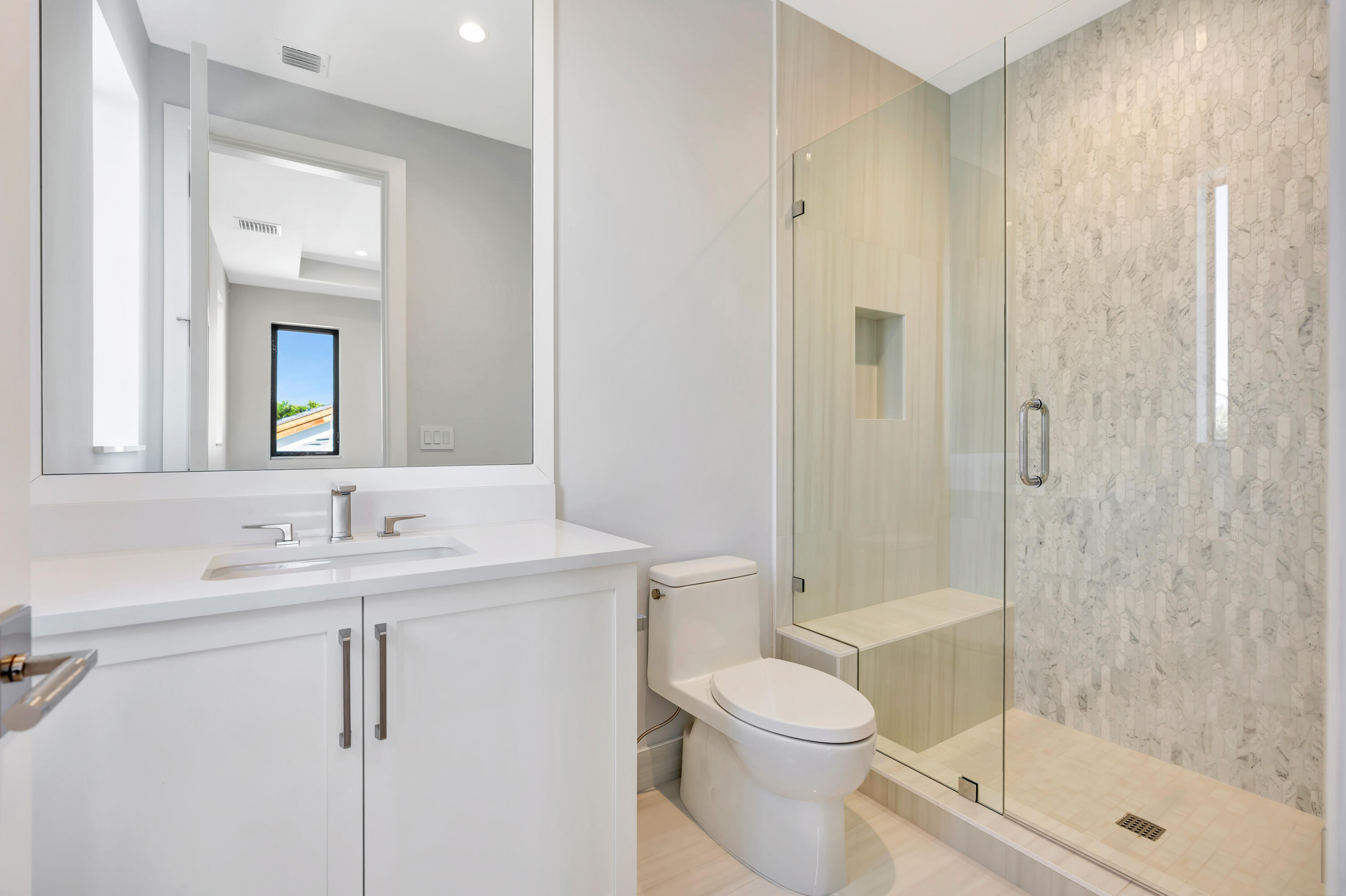 112 Regatta Drive Jupiter, FL 33477 - Photo 51 of 85 a bathroom with a sink a toilet and shower