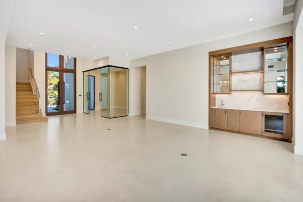 a view of an empty room with glass door