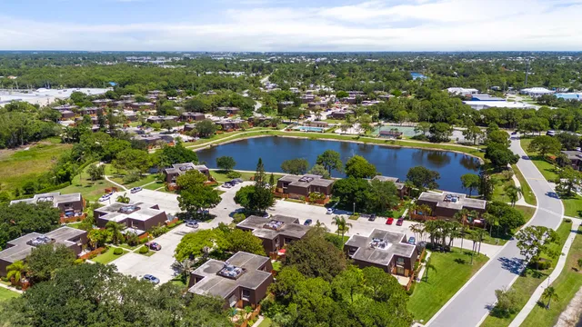 an aerial view of residential houses with outdoor space